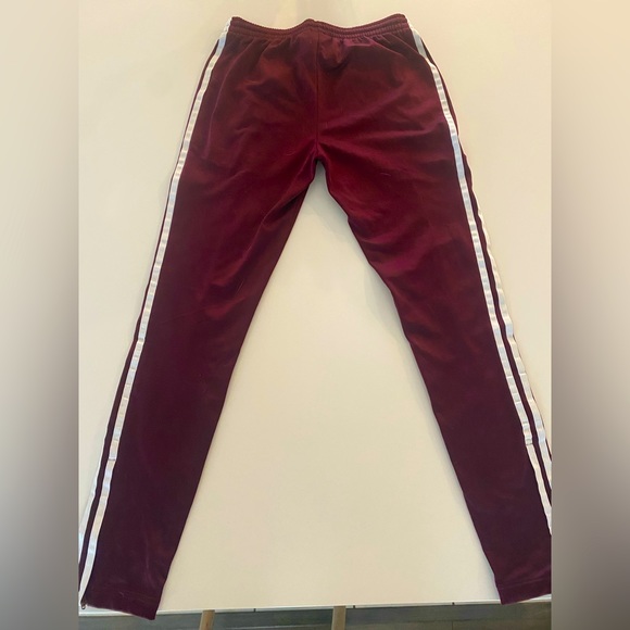 Adidas sports pants with adjustable zipper on bottom of pant. - Picture 2 of 4